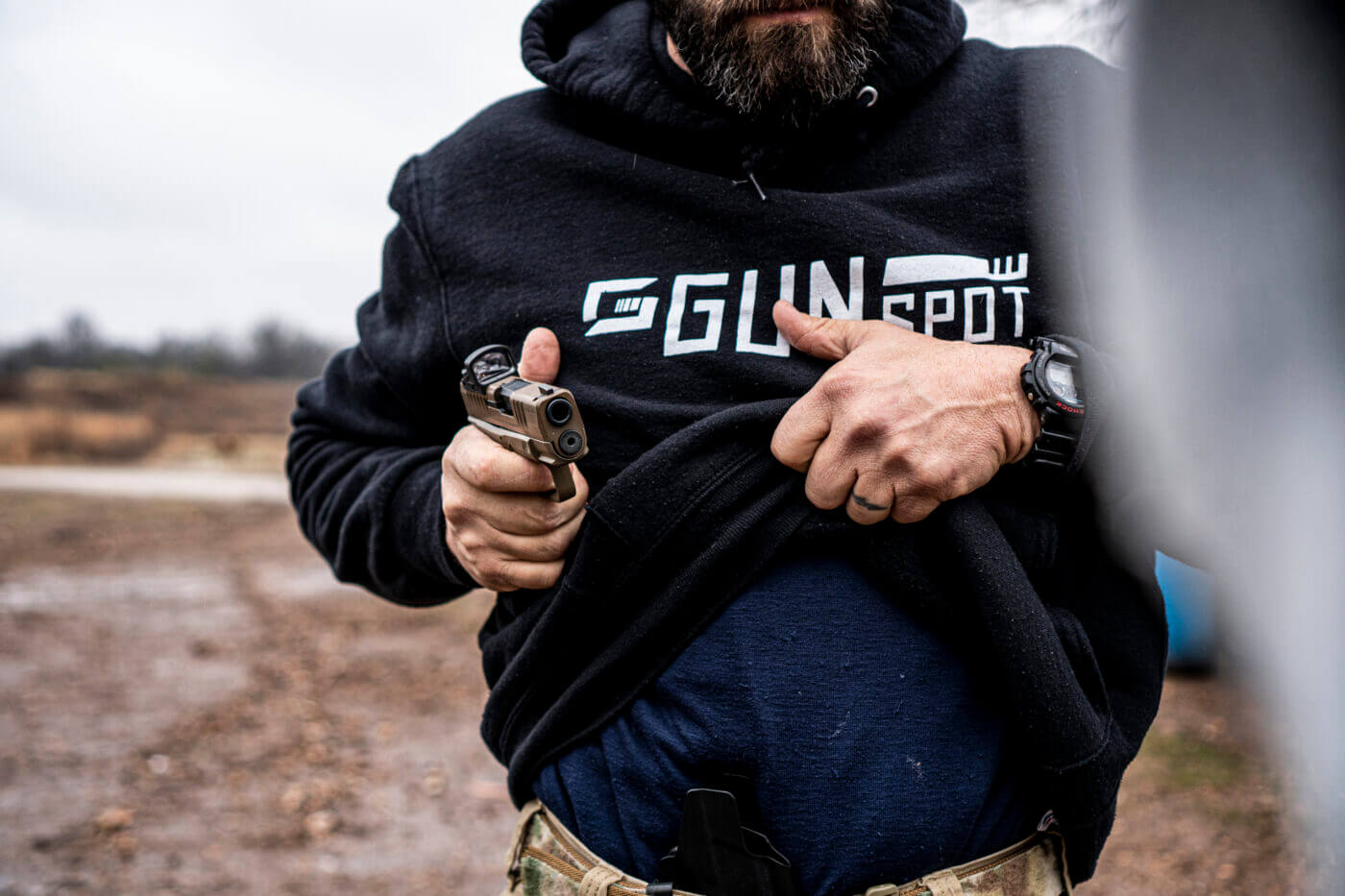 Man rotating the gun to the target