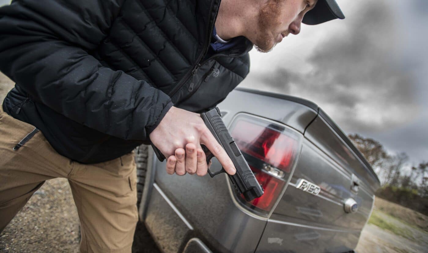 Man using Springfield Armory XD-M handgun as a truck gun