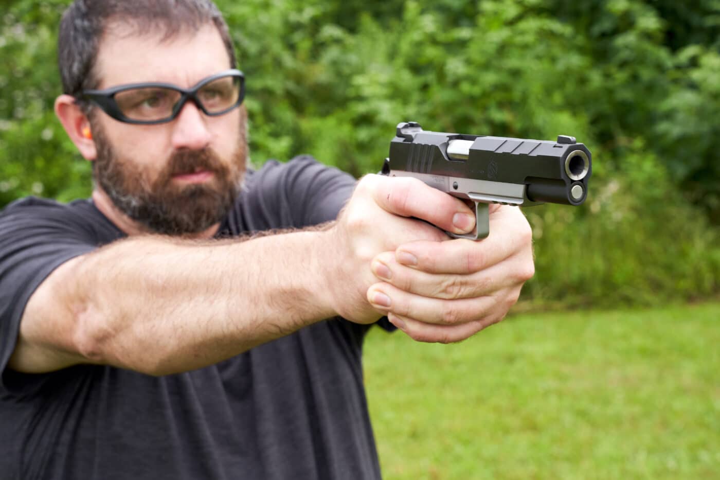 Man shooting the SA Emissary on the range