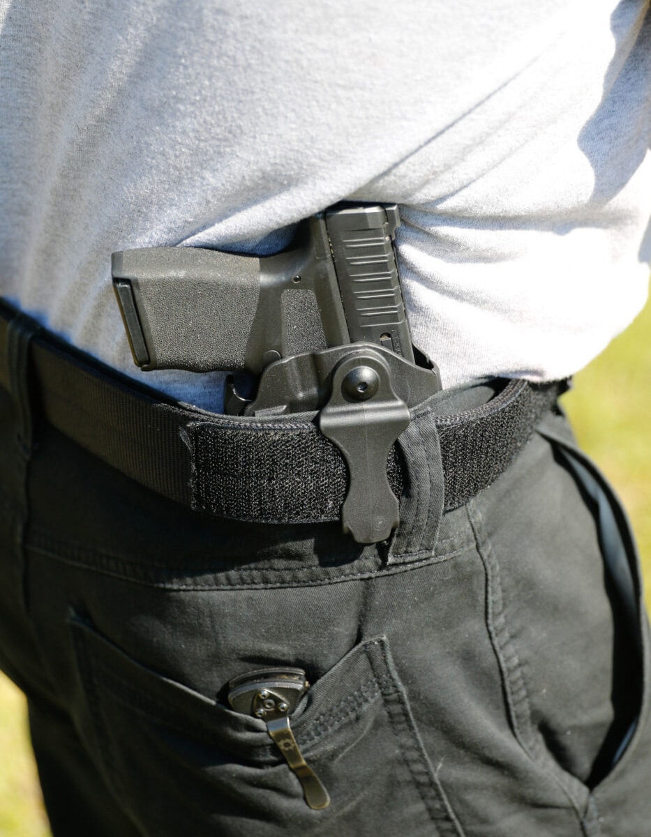 Man carrying Hellcat in a Safariland IWB carry rig