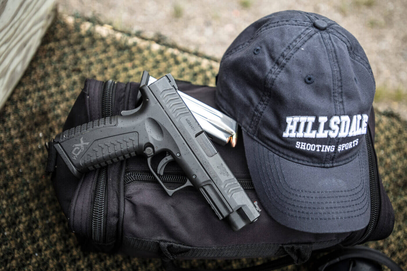 Springfield Armory pistol and Hillsdale College ball cap