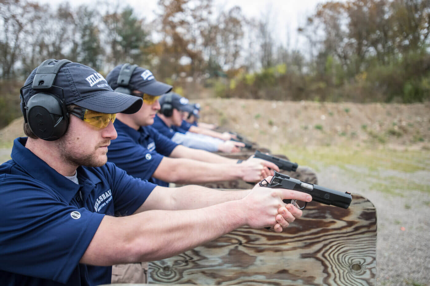 Men in Olympic shooting training on the range at Hillsdale College