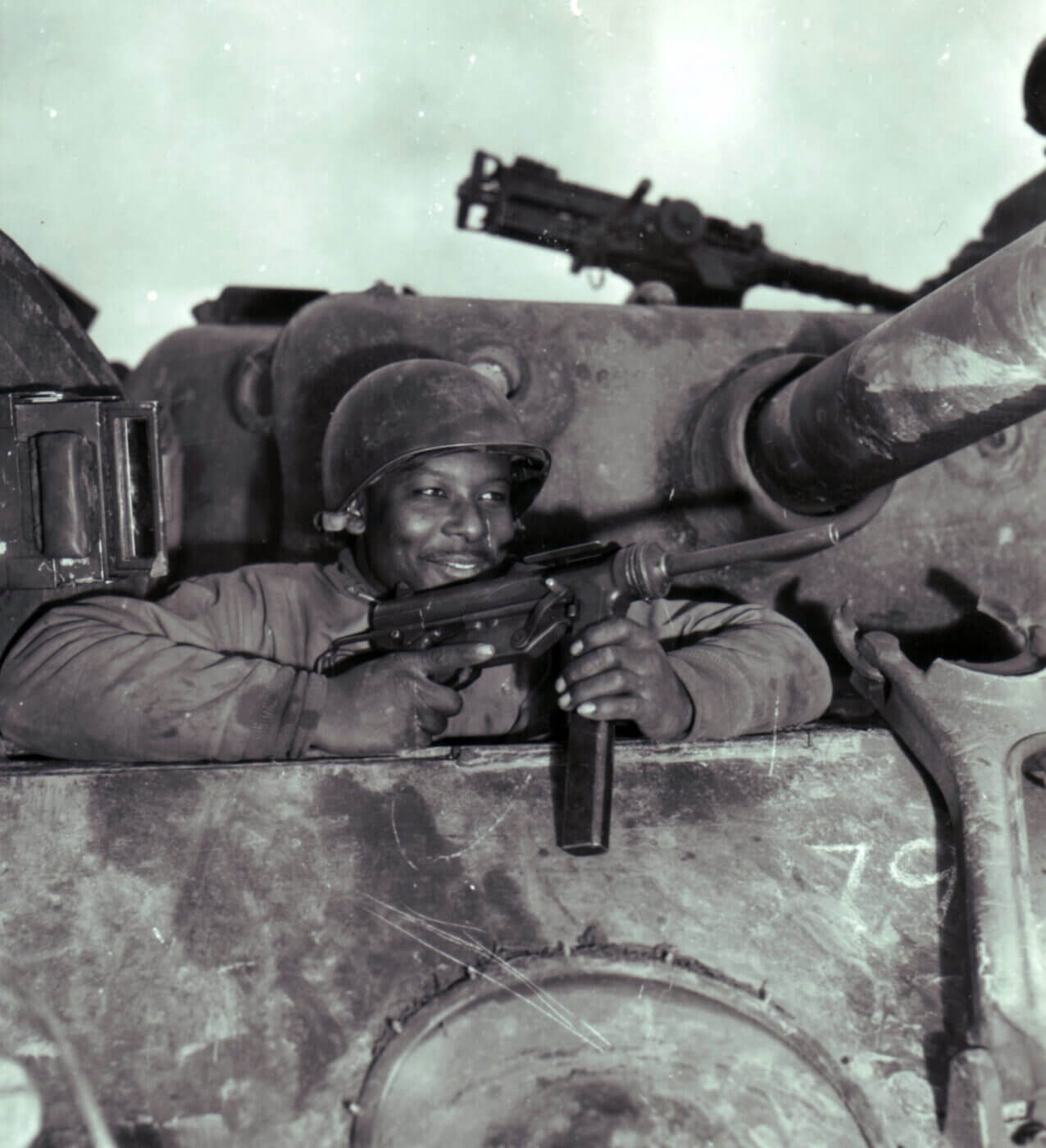 Soldier in tank with M3 grease gun