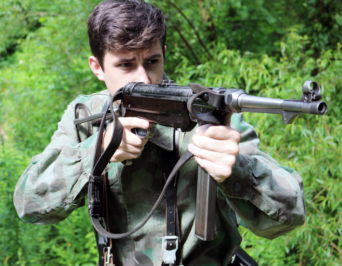 Man shooting an MP40 SMG on the range