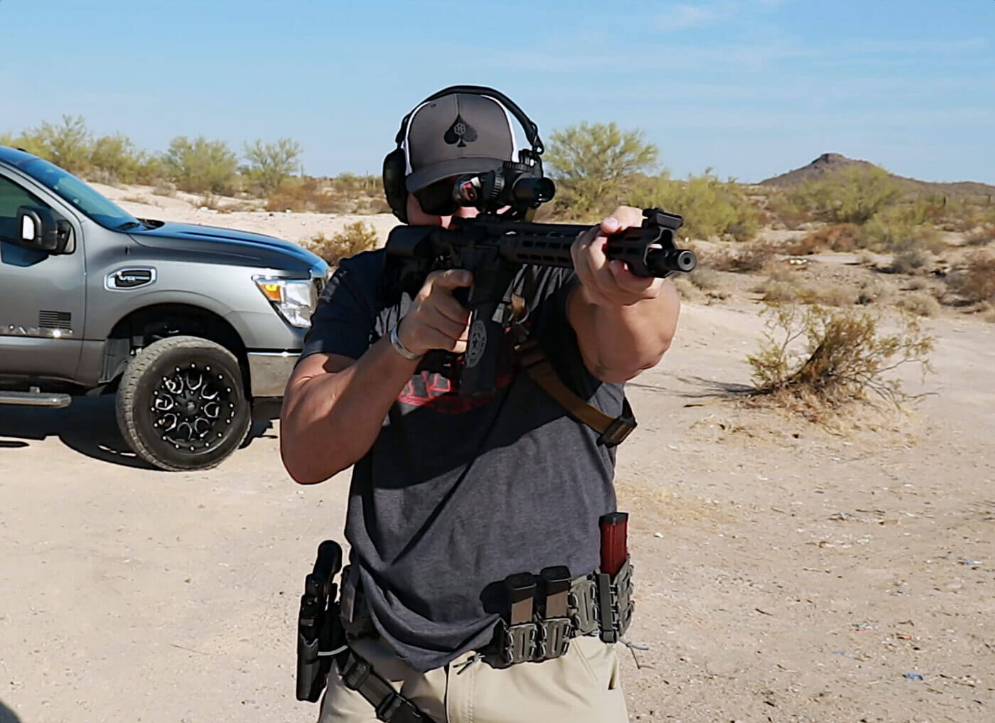 Man testing the Riton optic on the range with a SAINT Victor rifle