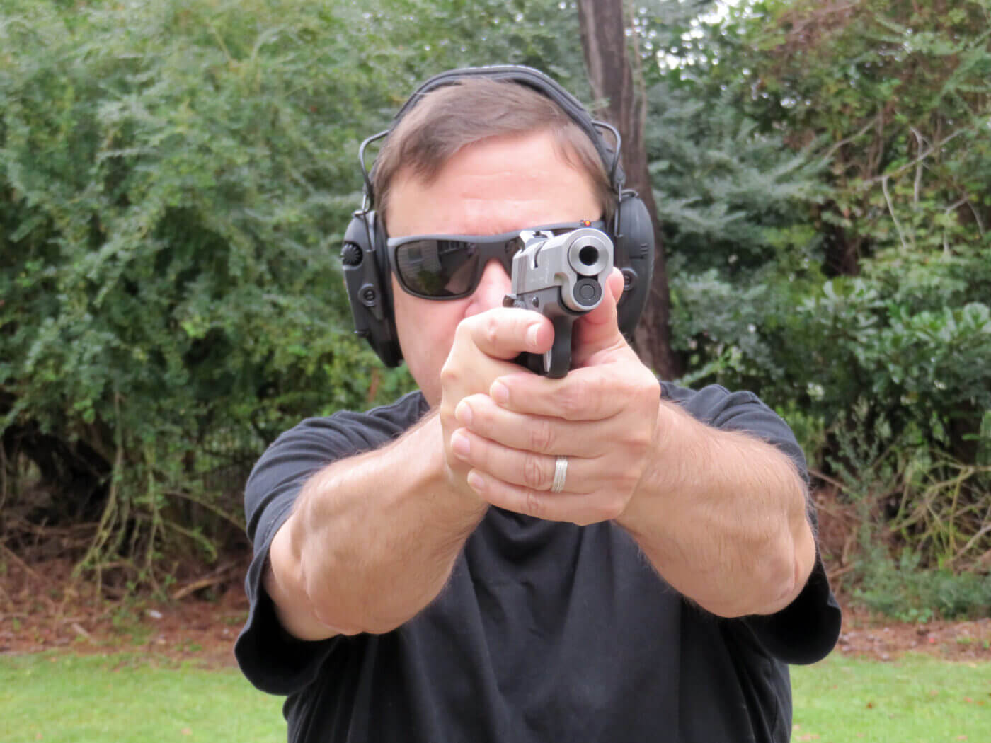 Man shooting the Springfield Armory EMP Concealed Carry Contour pistol on the range