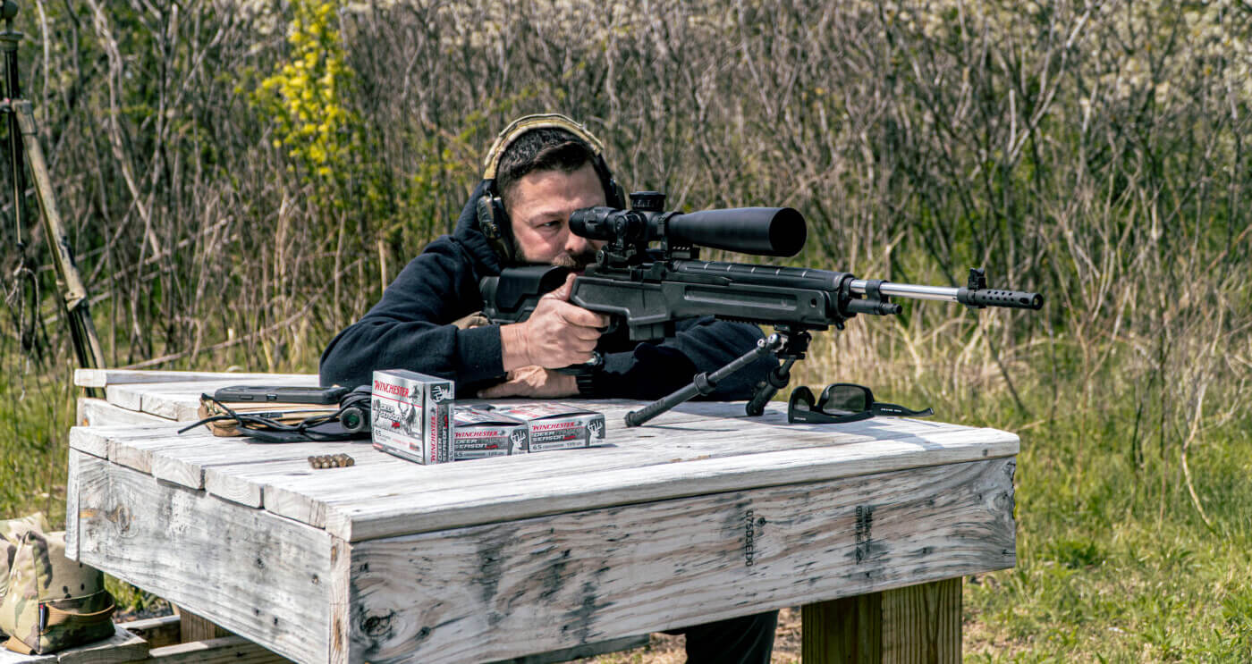 Man field testing the M1A Loaded Precision rifle