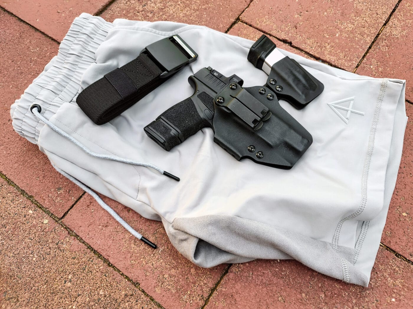 Pistol shown on top of concealed carry shorts