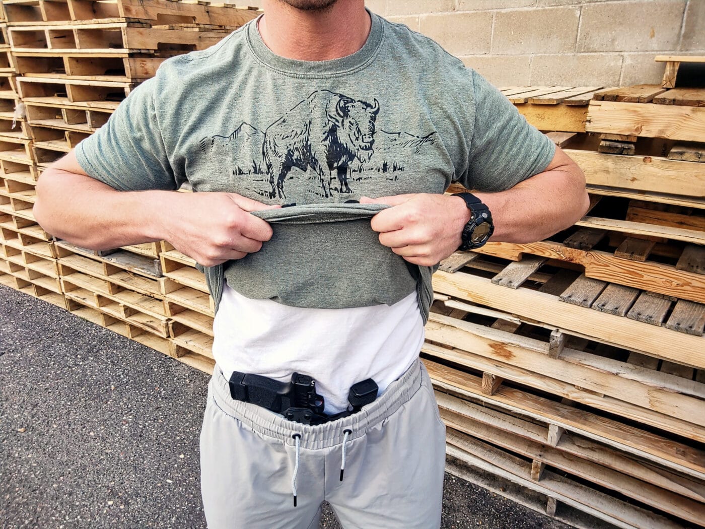 Man showing concealed carry athletic shorts