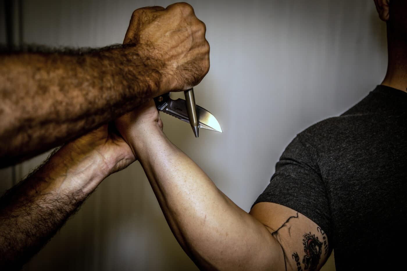 Blocking a knife with a pen