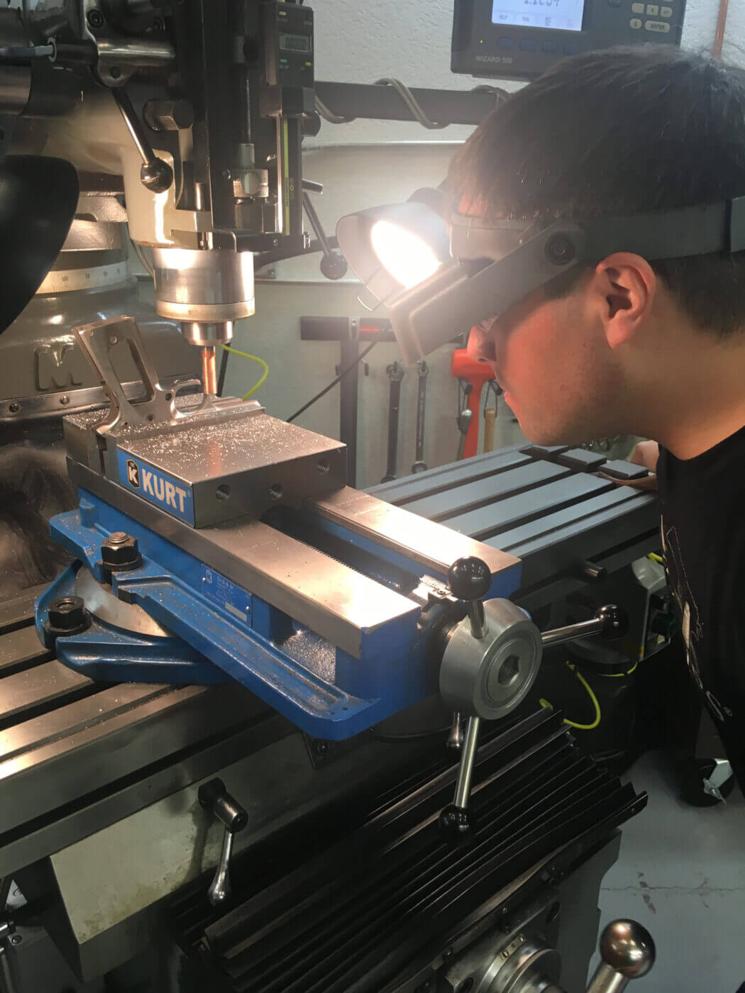 Man machining 1911 pistol parts