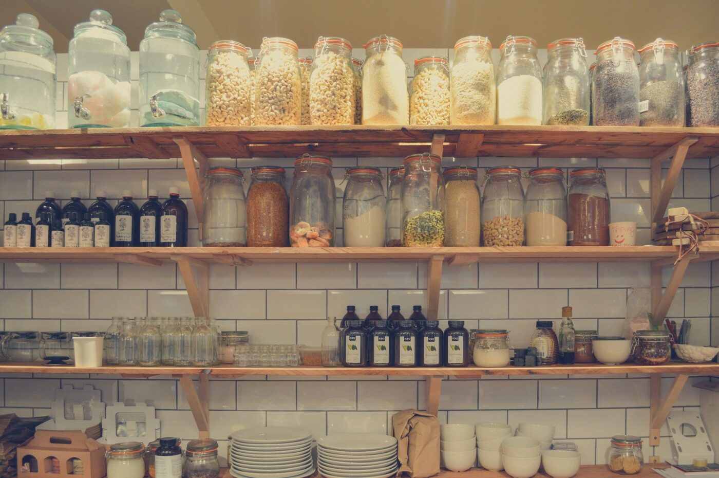 Canned goods on shelves in a kitchen