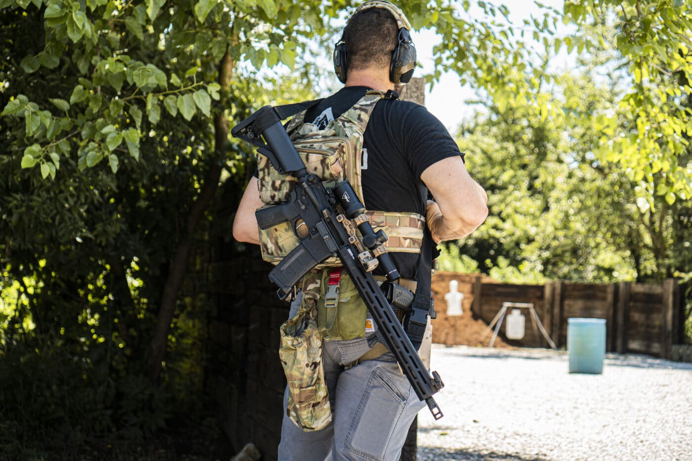 Man carrying rifle with a two-point rifle sling