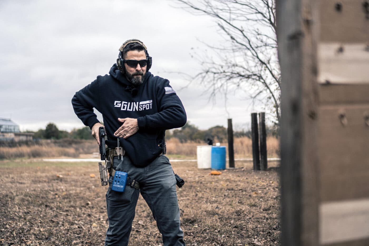 Man drawing pistol during combat marksmanship training