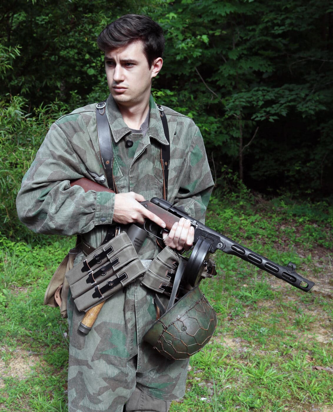 Man dressed as soldier from German army using of PPSh