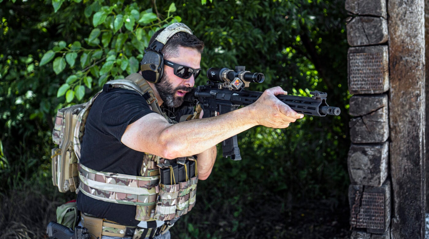 Man using a single point sling on an AR-15 rifle