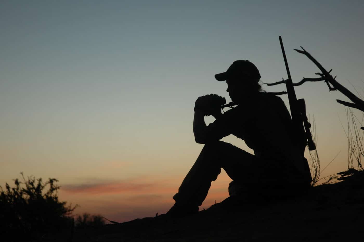 Image of woman hunting at dusk