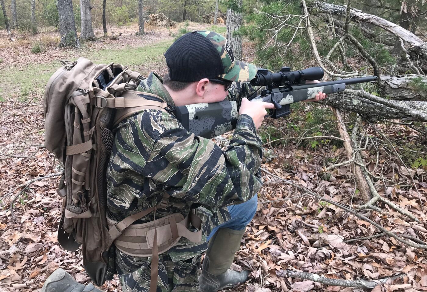 Man using Gunslinger II backpack on a hunt