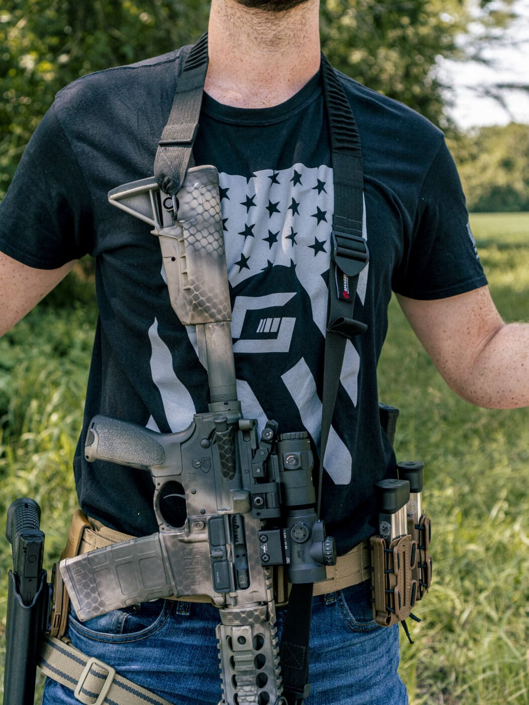 Man showing security of rifle with a sling