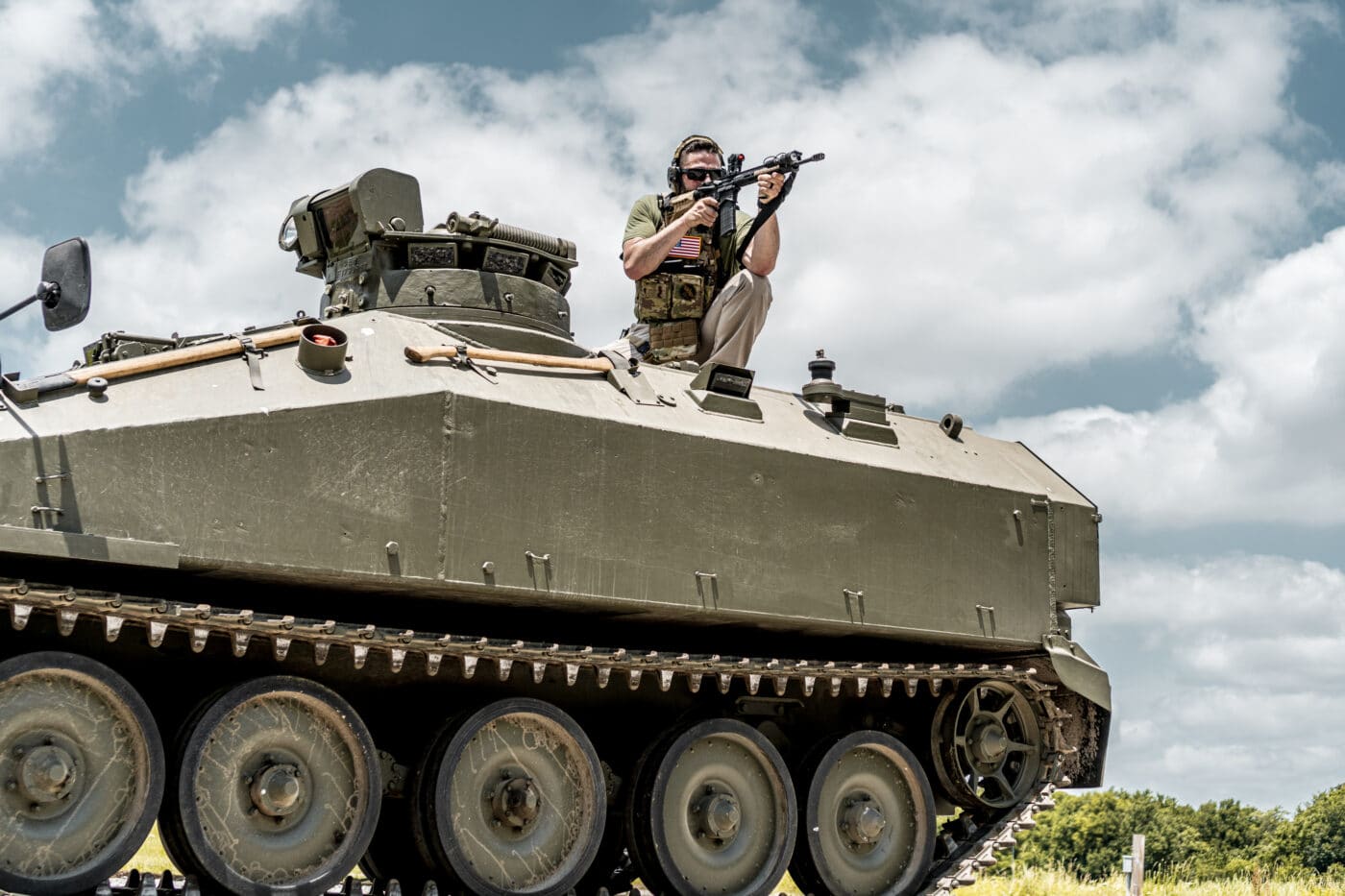 Man testing the HRT body armor from an APC