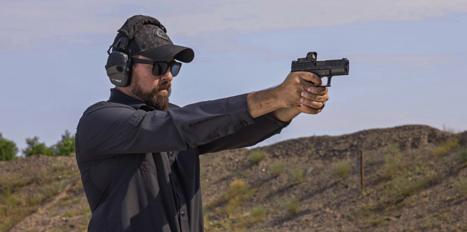 Man testing the XD-M Elite 10mm Compact OSP at the range