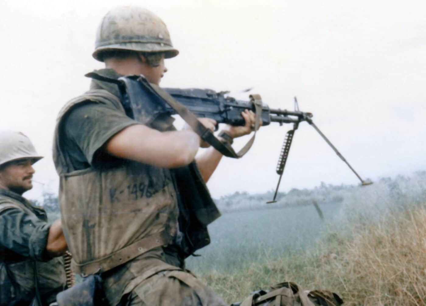 U.S. Marine fires the M60 machine gun from the shoulder in Vietnam