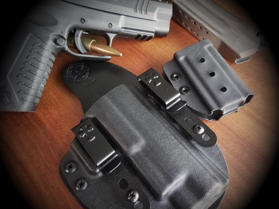 Crossbreed Reckoning IWB holster with Springfield Armory pistol next to it