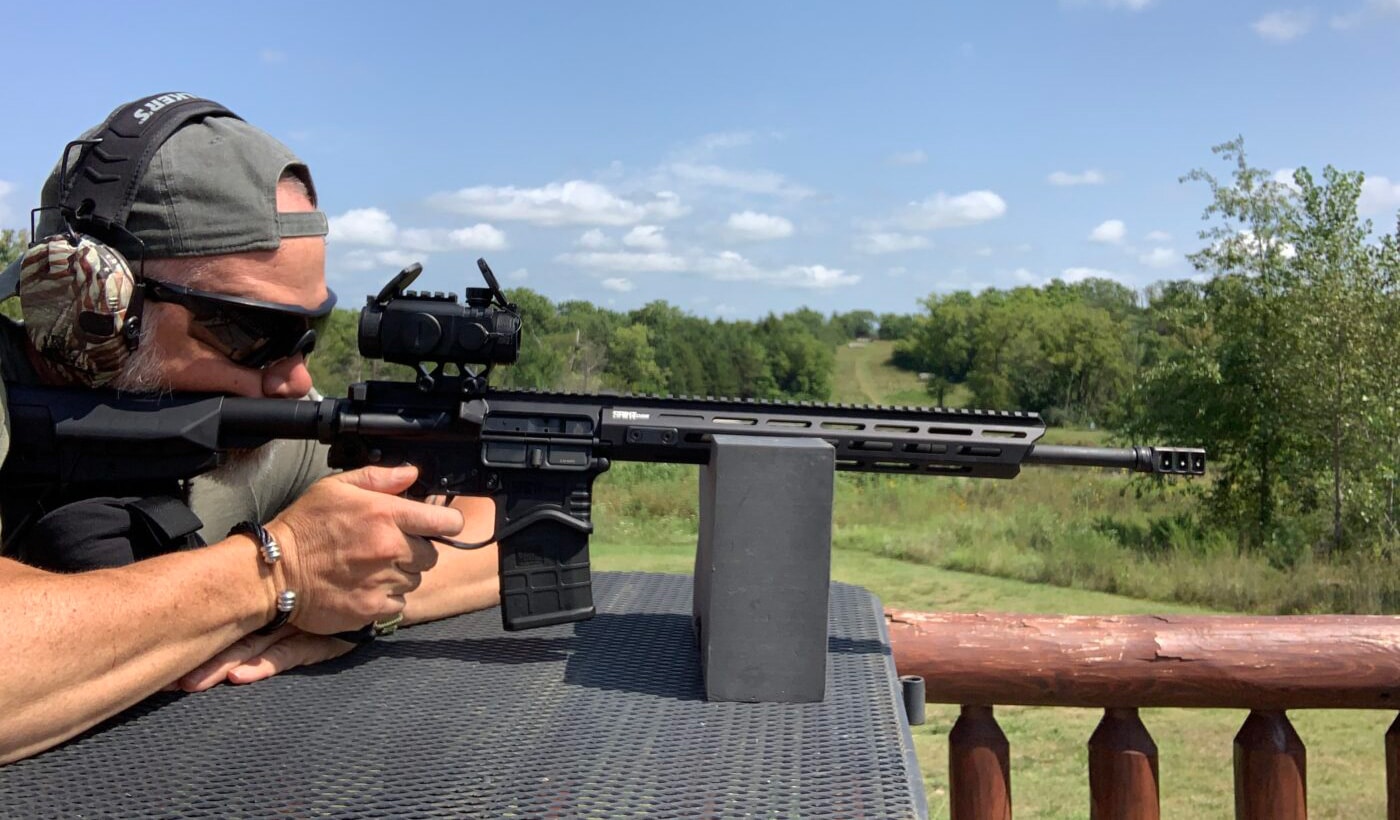 Man testing the AT3 Tactical 3X Prism Scope on the range