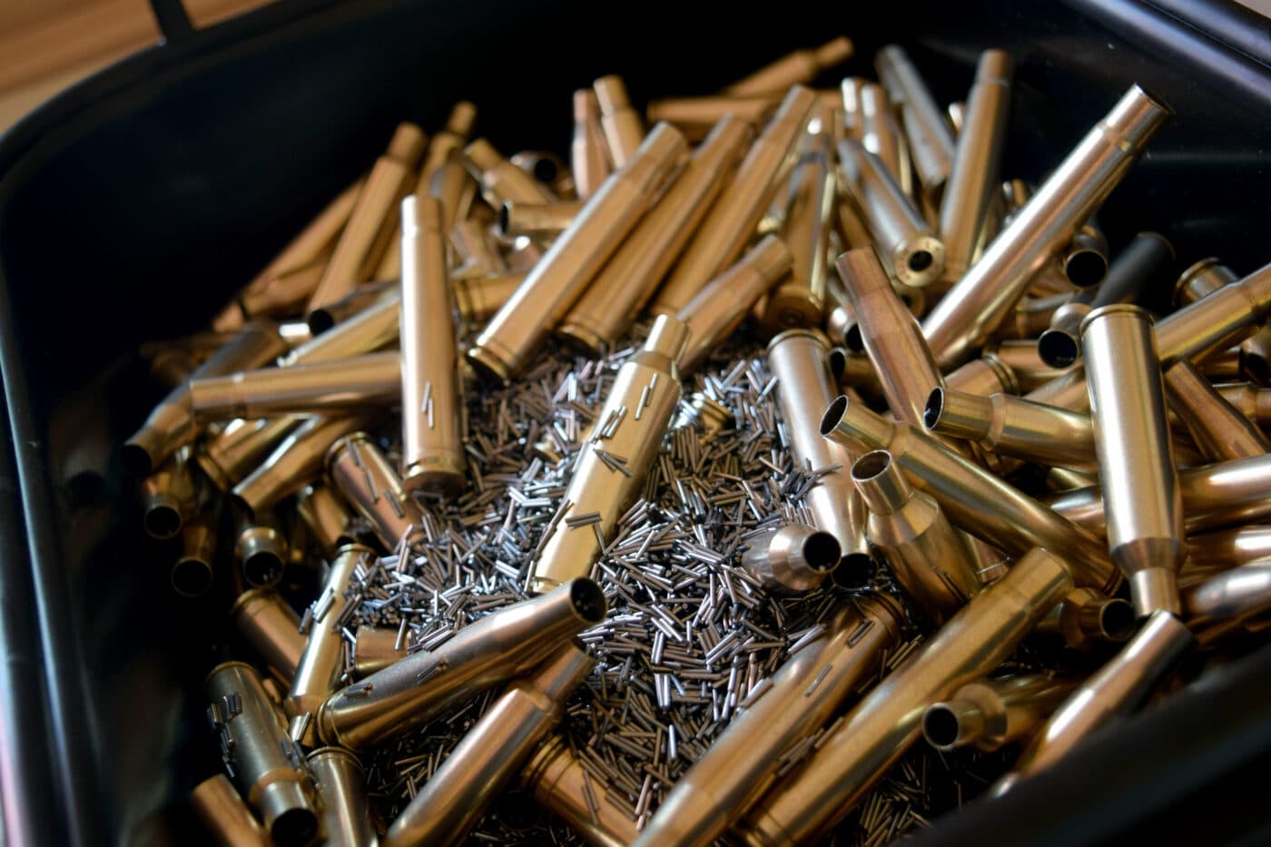 Cleaning brass cases with stainless steel media in a wet tumbler