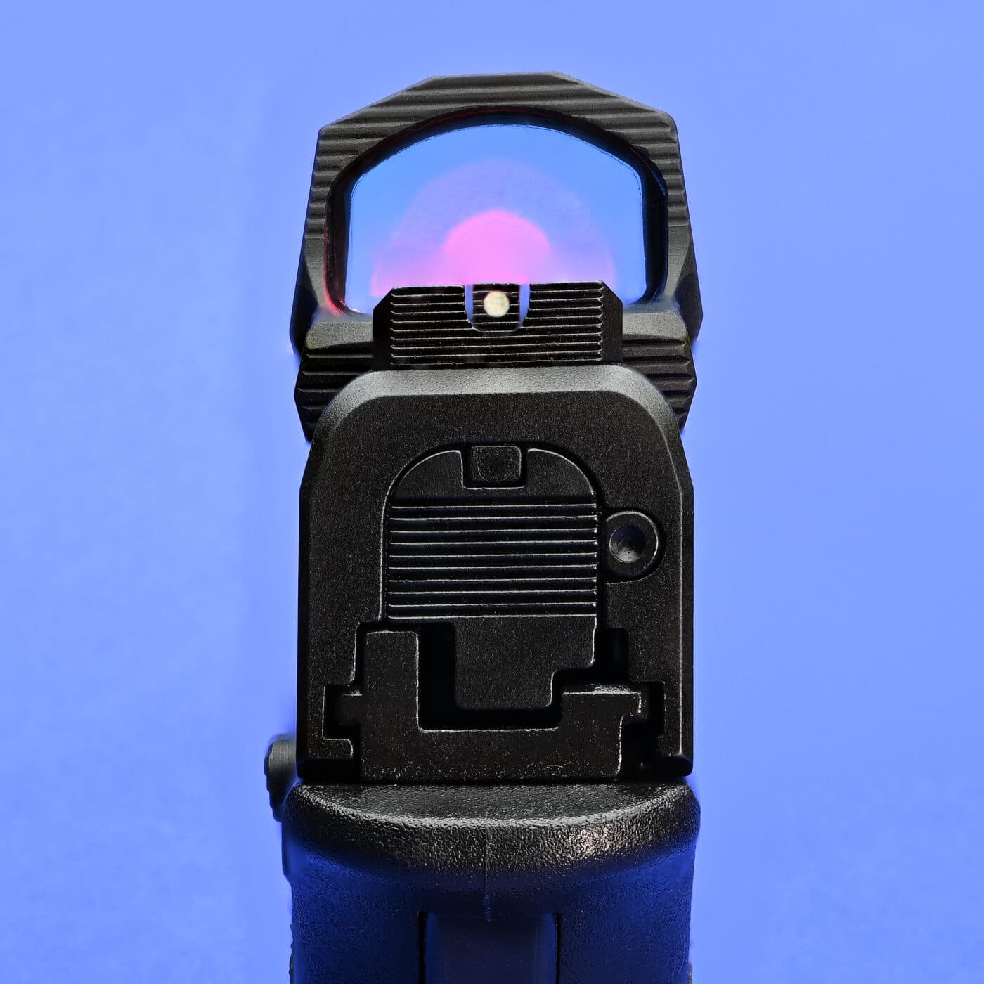 HEX Wasp red dot sight co-witnessed with iron sights