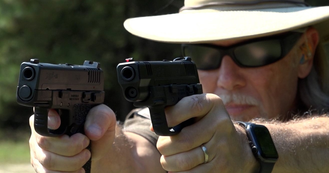 Man dual wielding Springfield XD-E pistols