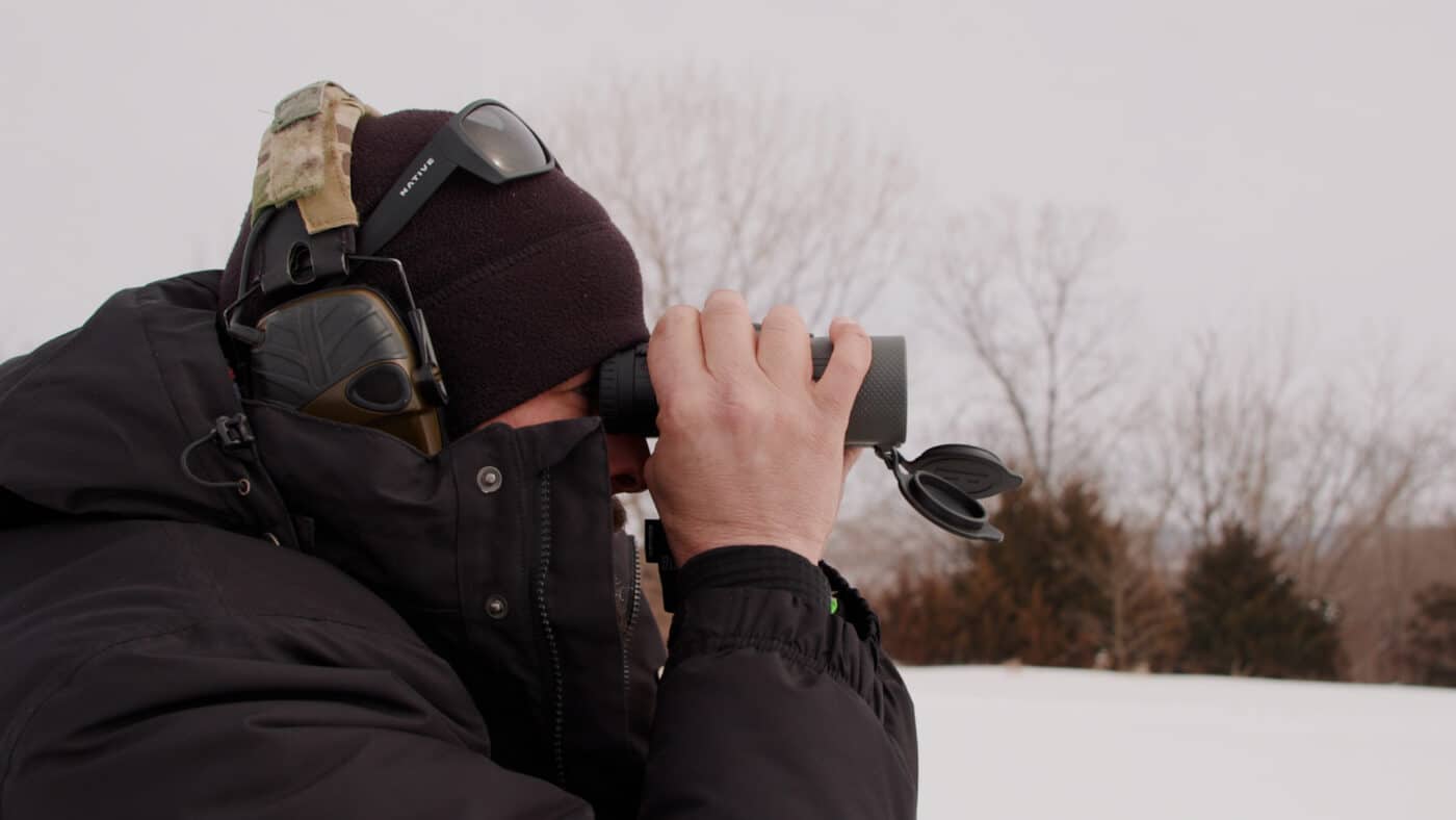 Man testing Bushnell binos in the field