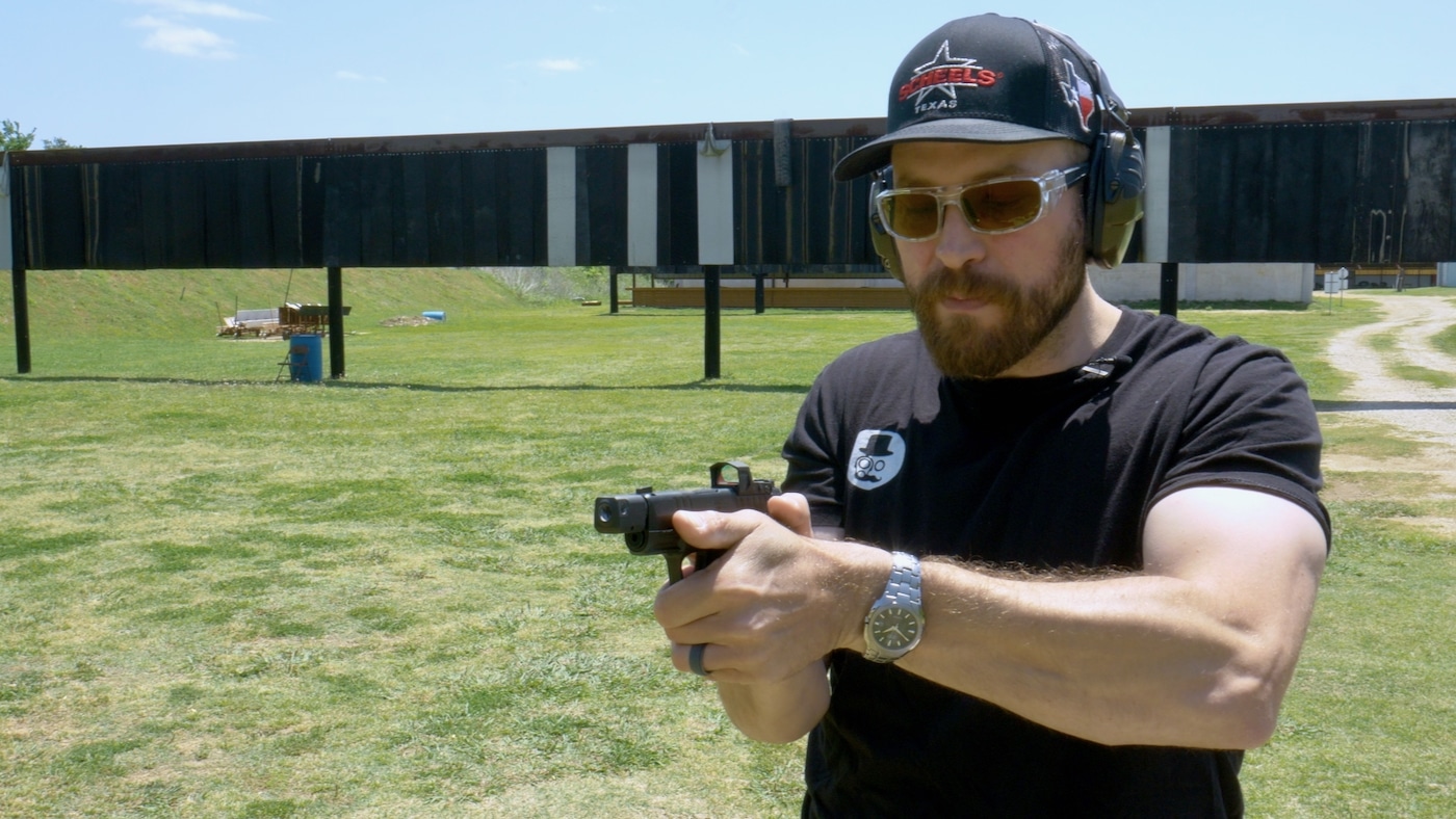 Man holding Hellcat RDP in two handed grip