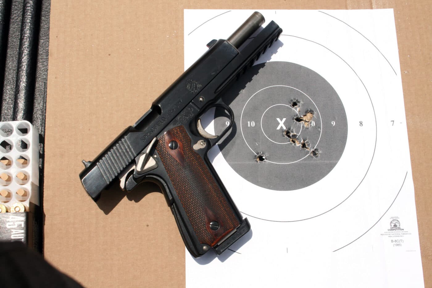 1911 pistol with target after training on the range