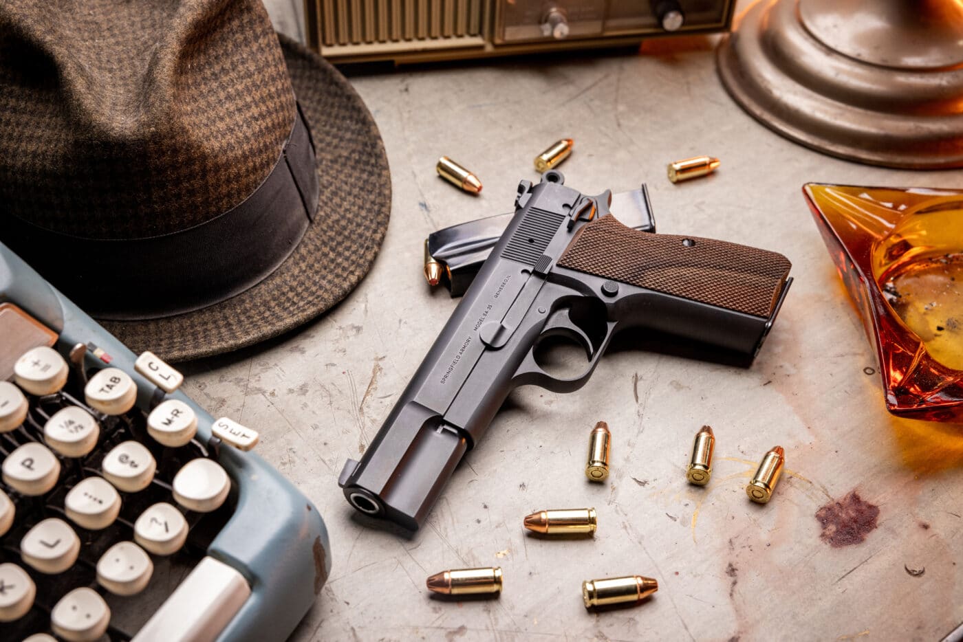 Springfield Armory SA-35 pistol on table with ammo