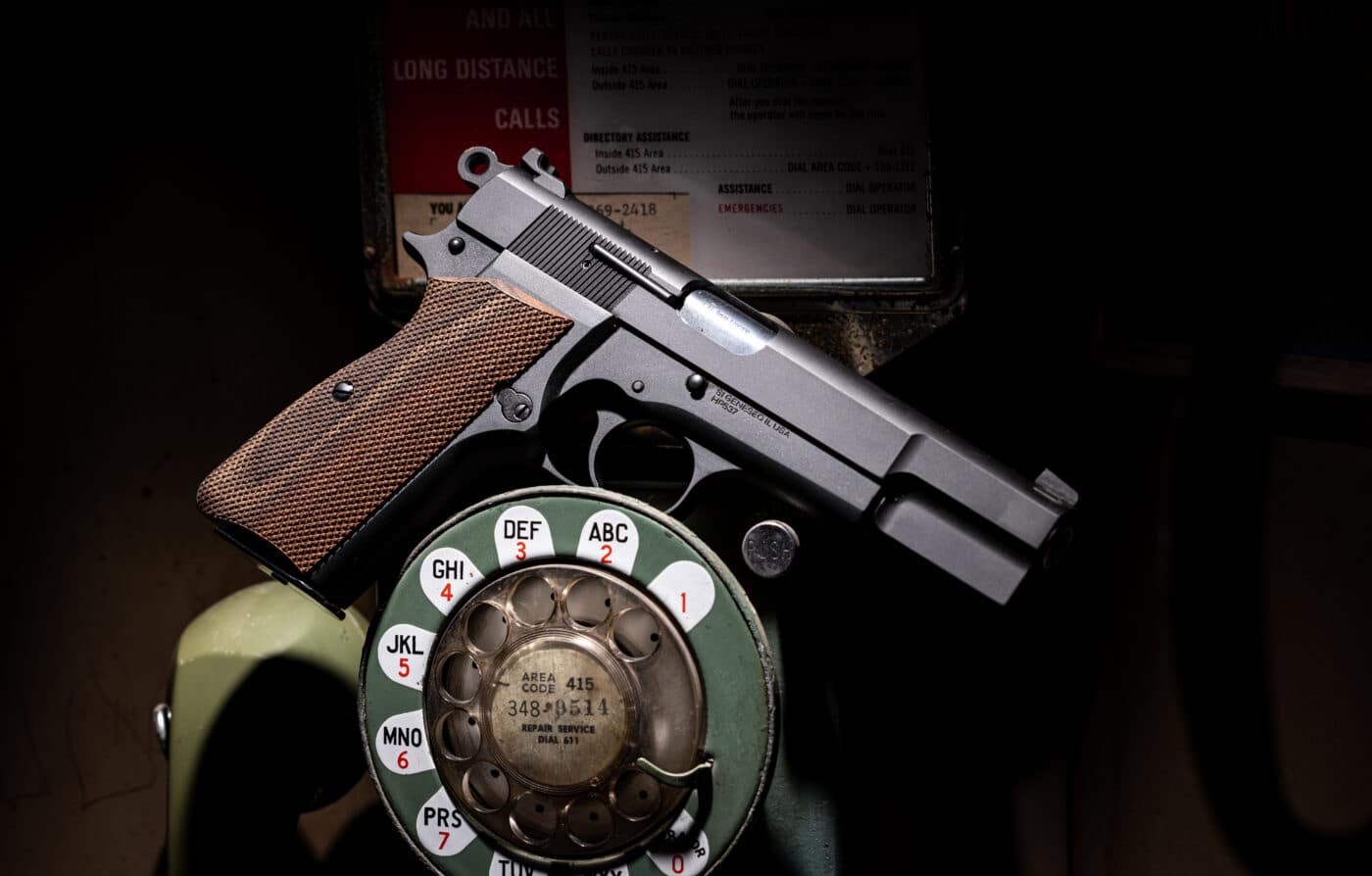 Springfield Armory SA-35 pistol balancing on a rotary phone