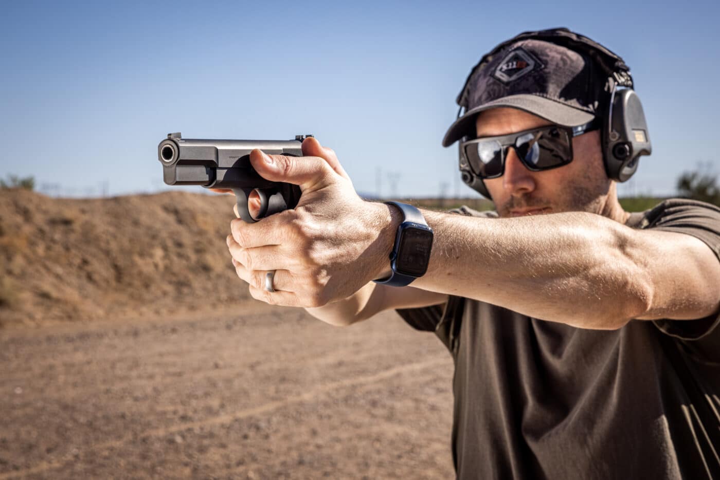 Man shooting the SA-35 pistol on an open range