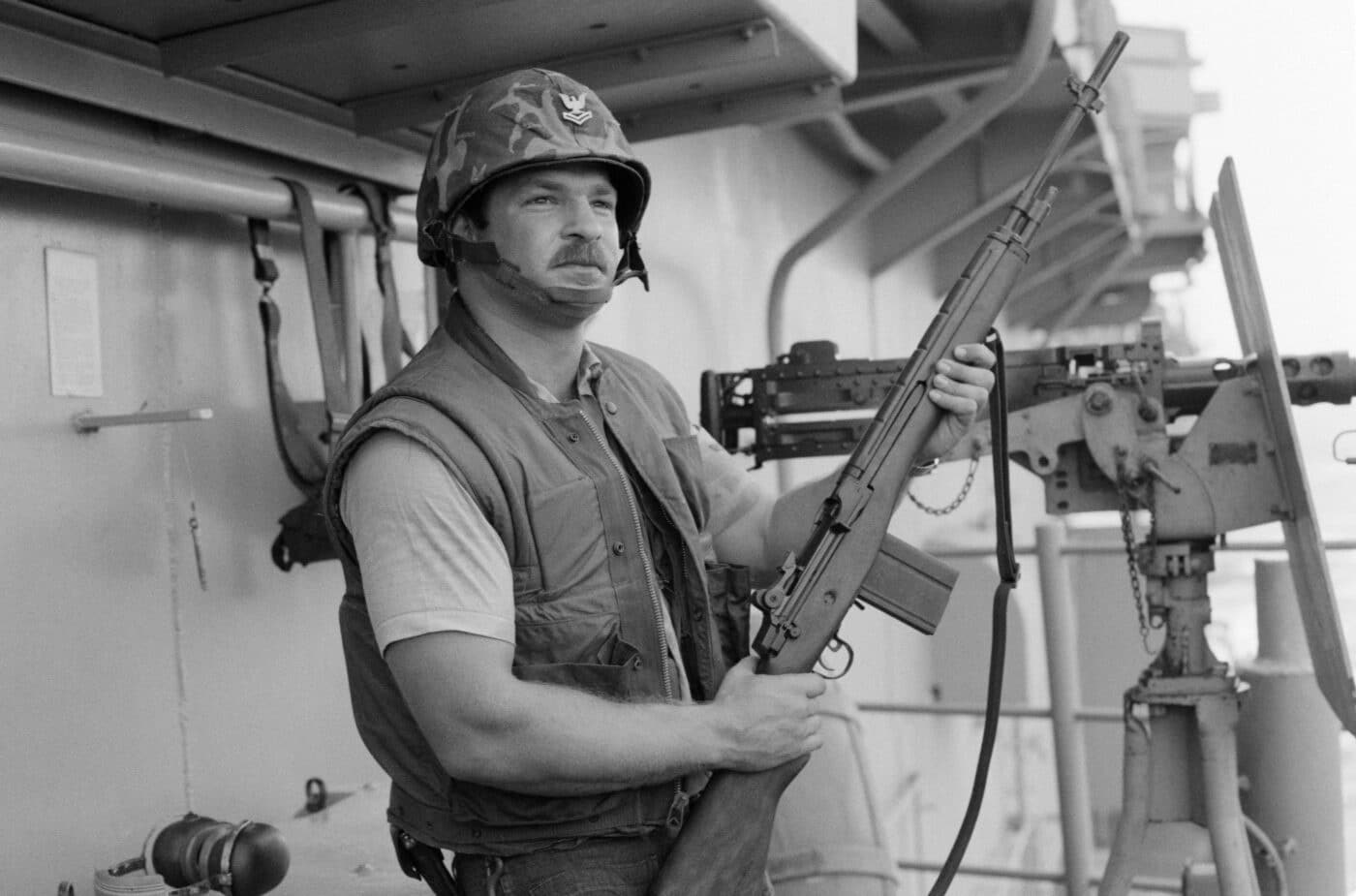 Sailor stands watch with M14