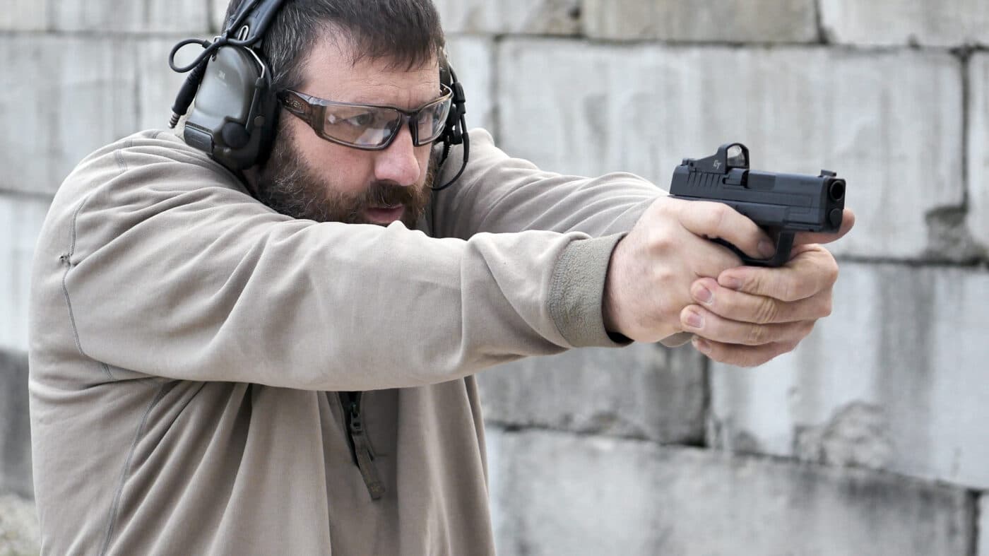 Man shooting an XD-S Mod.2 OSP 3.3″ .45 ACP pistol