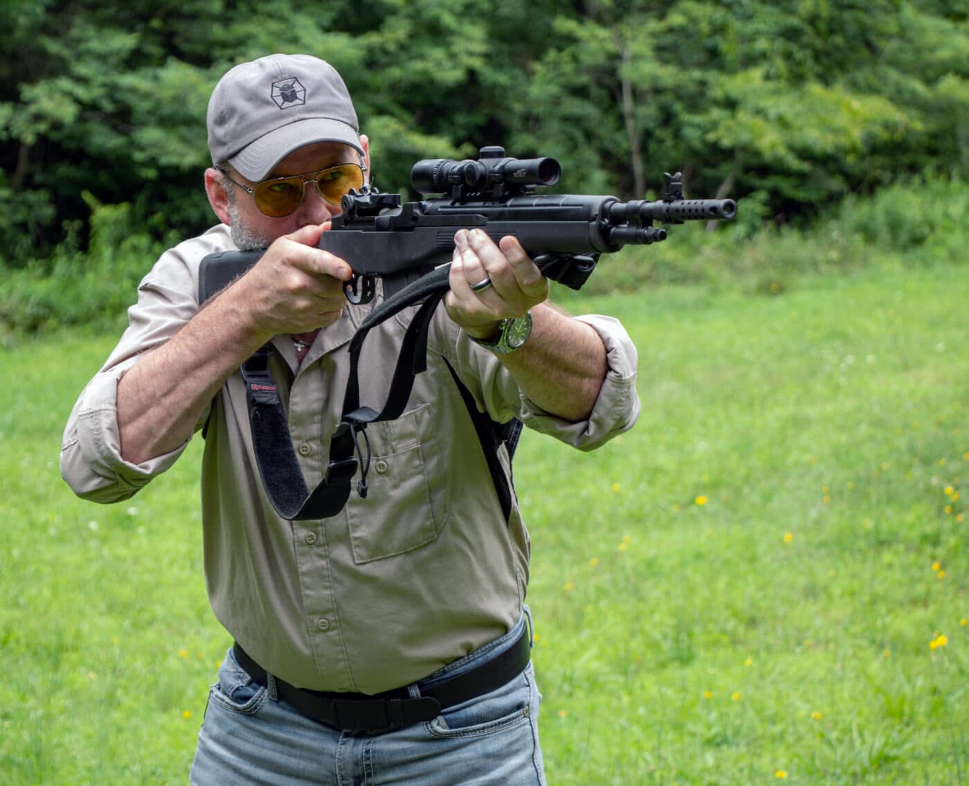 Man shooting M1A Scout Squad rifle with scout scope