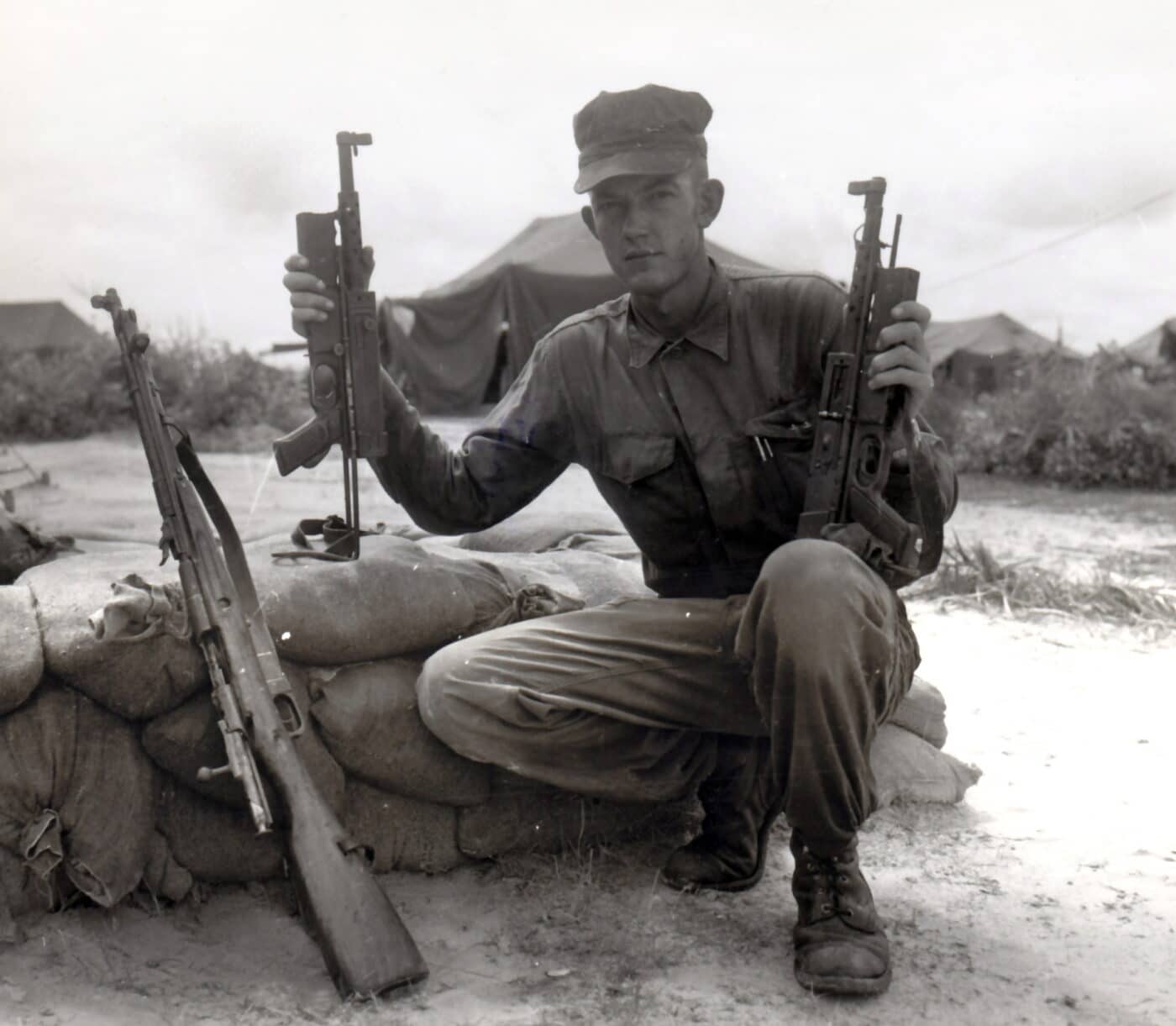 US Marine with captured Viet Cong firearms