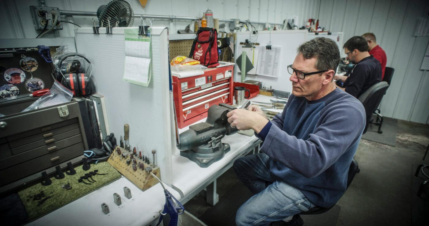 Springfield custom shop armorer working on a pistol