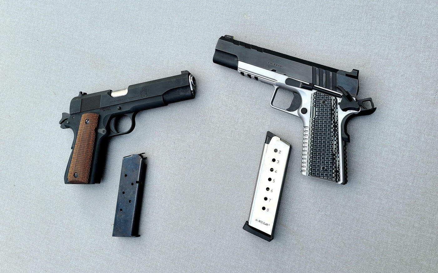 Springfield Armory Mil-Spec 1911 and Emissary pistols with magazines