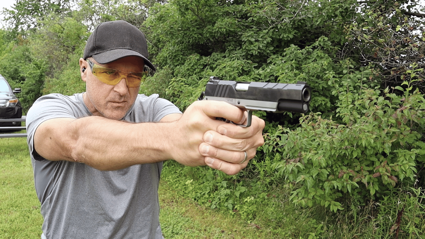 Man shooting a Springfield Armory Emissary on the range
