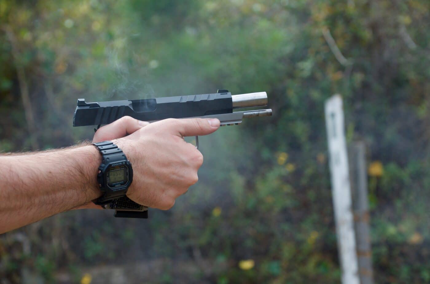 Springfield 1911 Emissary pistol with G10 laminate grips by VZ Grips being shot at the range