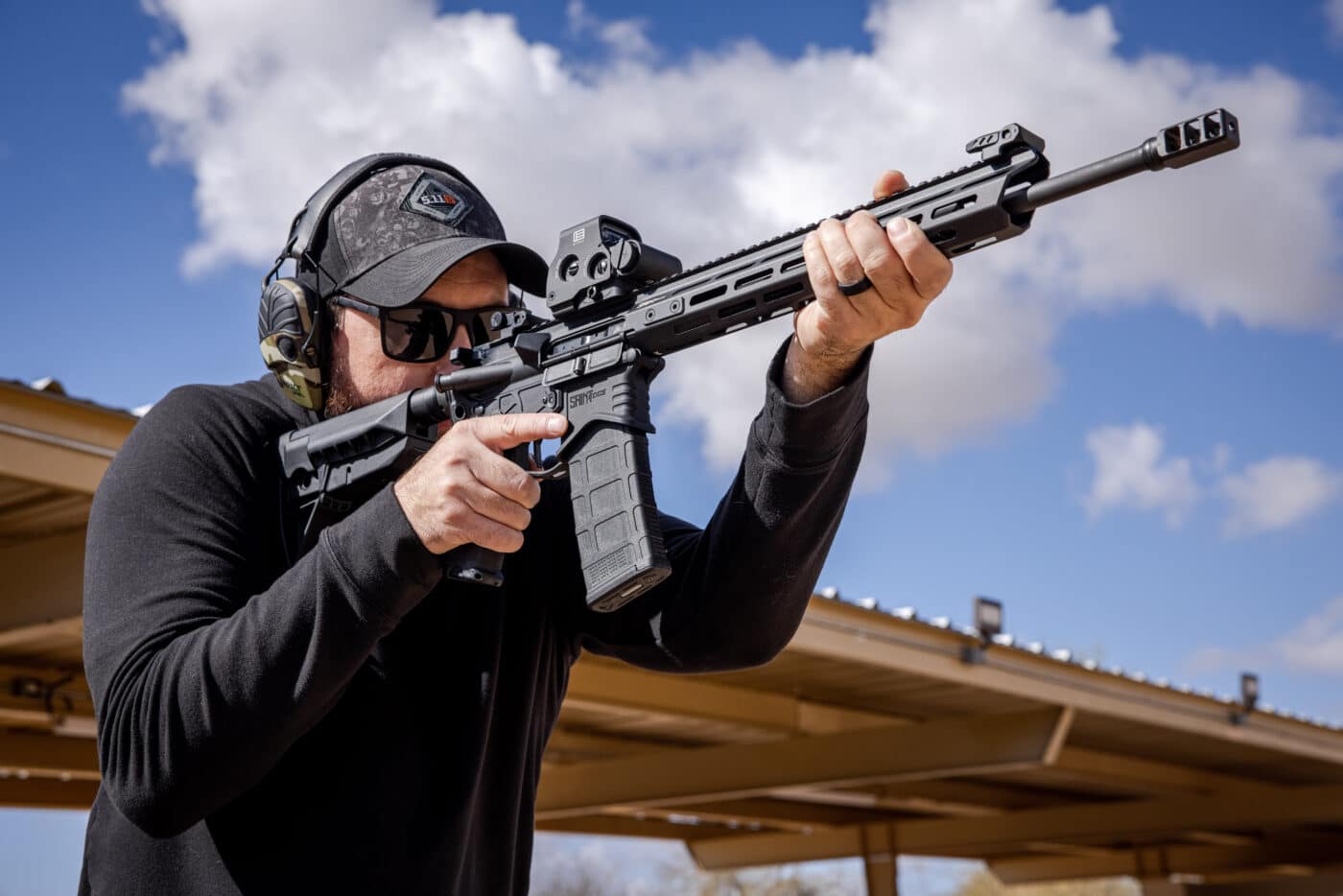 Man shooting SAINT Edge AR-15 rifle
