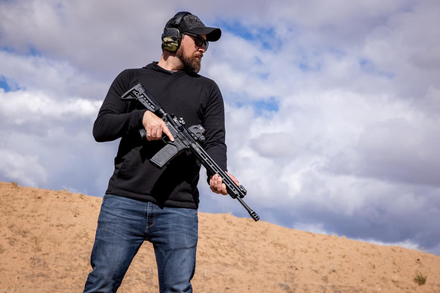 Man holding a pre-built AR-15