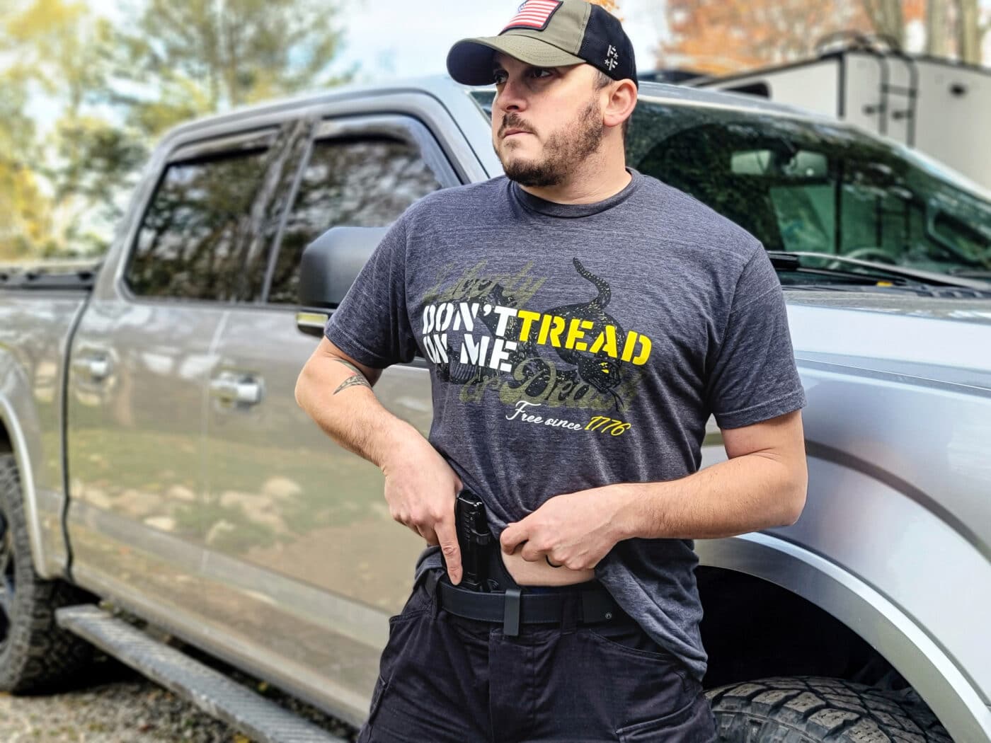 Man drawing pistol from appendix carry