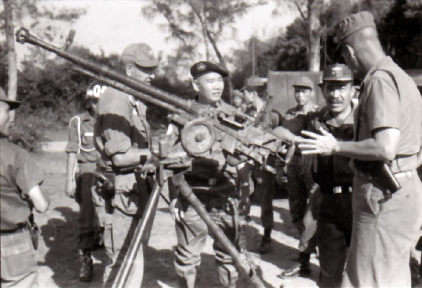 Soldiers examine DSHK heavy machine gun outside of Quang Ngai