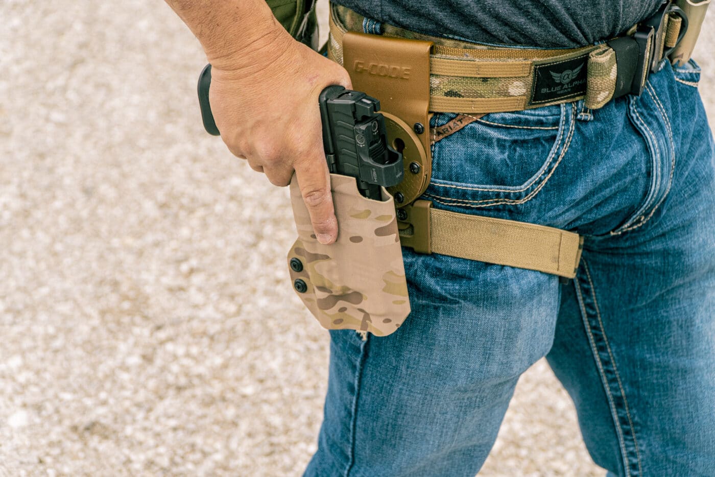 Drawing pistol from holster attached to a battle belt